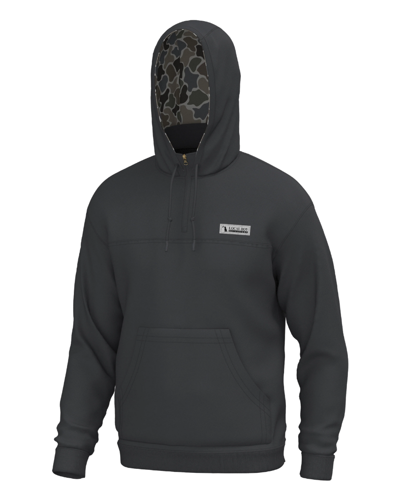 A dark gray pullover hoodie with a drawstring hood, kangaroo pocket, and a small white rectangular logo patch on the left chest. The inside of the hood features a camouflage pattern lining.