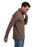Man wearing a brown jacket and blue jeans on a white background