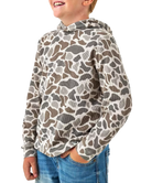 A child wearing a long-sleeve hooded top with an allover organic animal-print pattern in beige, brown, and gray, paired with blue jeans against a plain white background.