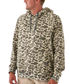 Camouflage-patterned hoodie worn by a person on a white background
