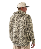 Person wearing a camouflage-patterned hoodie on a white background