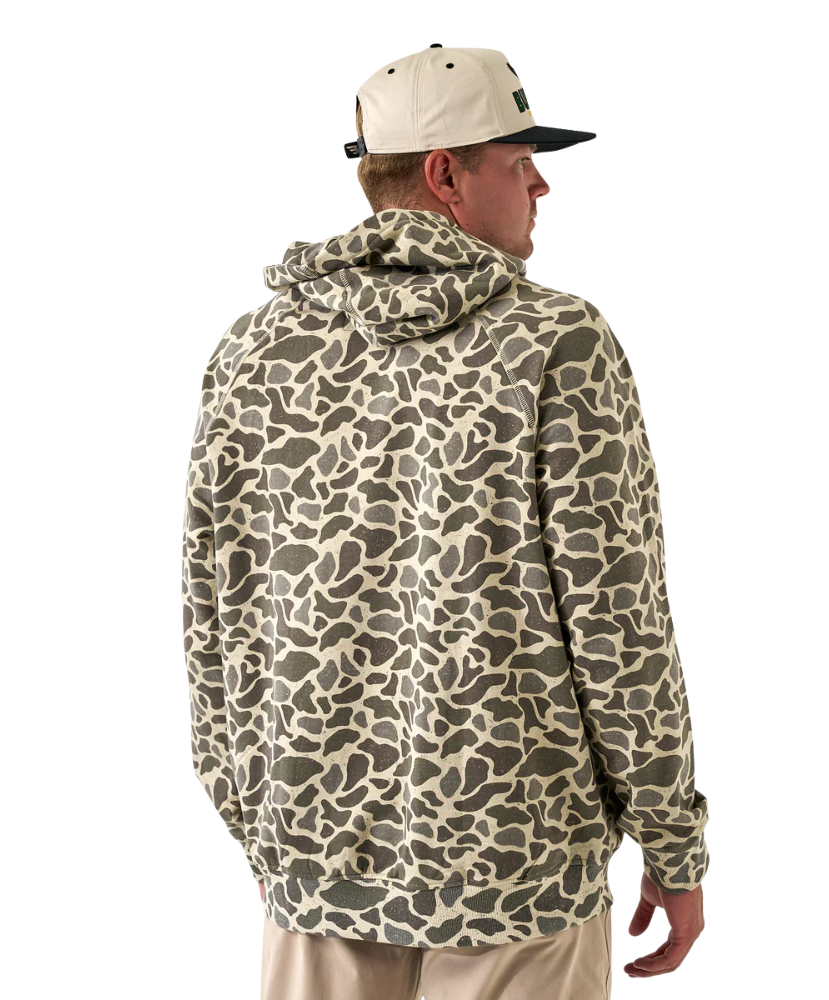 Person wearing a camouflage-patterned hoodie on a white background