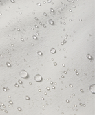 Close-up of water droplets on a shorts surface with a light gray background