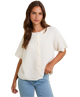 Woman wearing a white blouse and blue jeans on a white background