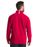 Man wearing a crimson pullover on a white background