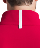 Man wearing a crimson pullover on a white background