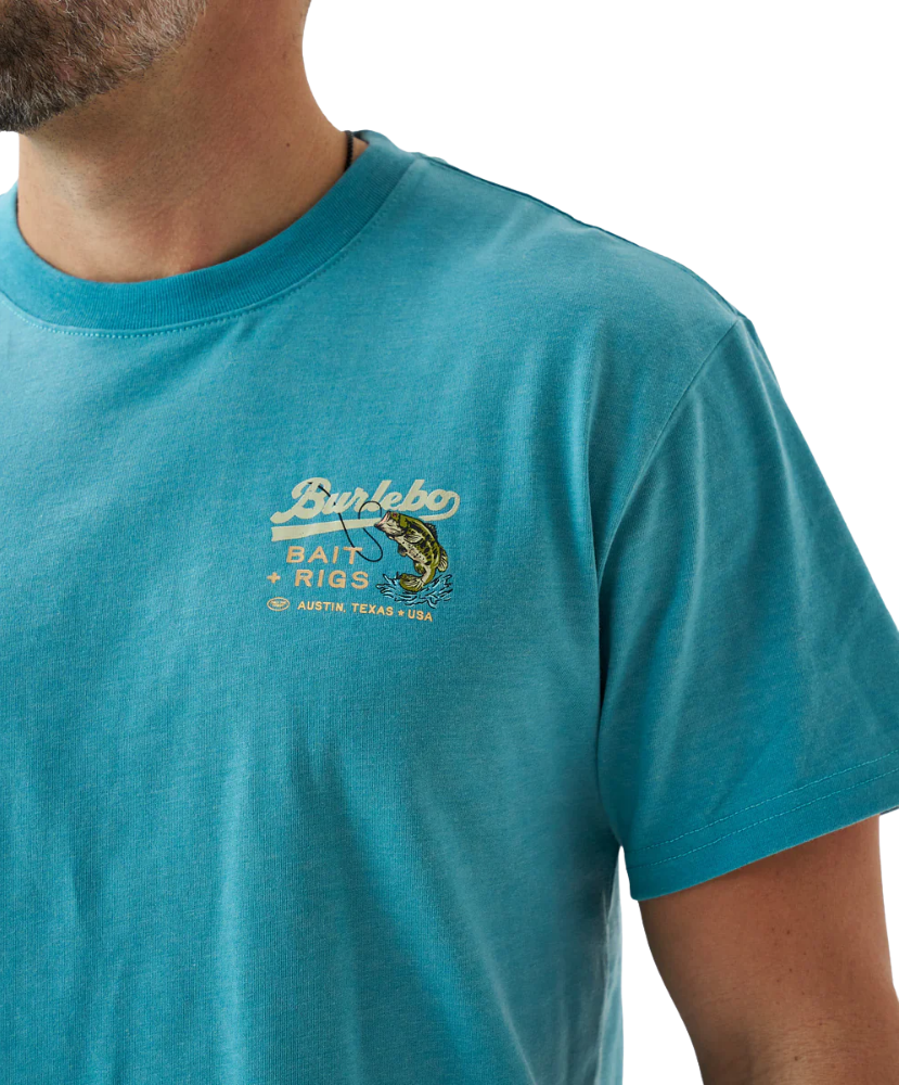 Person wearing a blue t-shirt with a largemouth bass and 'Burlebo Bait + Rigs' branding and graphics.
