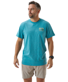 Person wearing a blue t-shirt with a largemouth bass and 'Burlebo Bait + Rigs' branding and graphics.