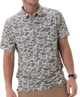Man wearing a camouflage-patterned polo shirt on a white background