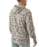 Person wearing a camouflage-patterned hoodie on a white background