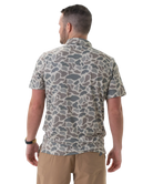 Man wearing a camouflage-patterned shirt on a white background