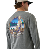 Gray long-sleeve shirt with a dog and nature graphic on the back, worn by a person.