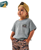 Child wearing a gray t-shirt with a jeep Burlebo logo and camouflage pants, standing against a white background.