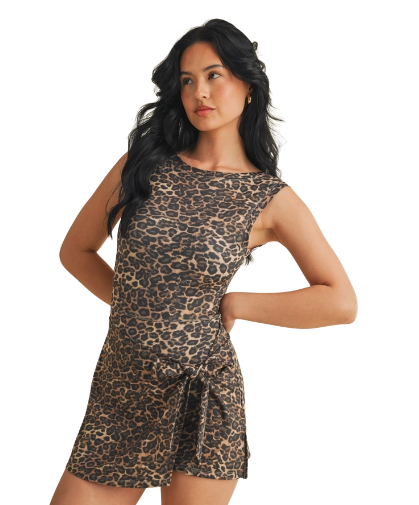 Woman wearing a leopard print dress on a white background