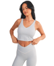 Woman wearing a light blue and white GINGHAM checkered tank on a white background