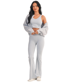 Woman wearing a light blue and white GINGHAM checkered tank on a white background