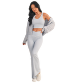 Woman wearing a light blue and white GINGHAM checkered tank on a white background