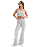 Woman wearing a light blue and white GINGHAM checkered tank on a white background