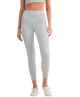 Person wearing blue and white gingham checkered leggings outfit on a white background