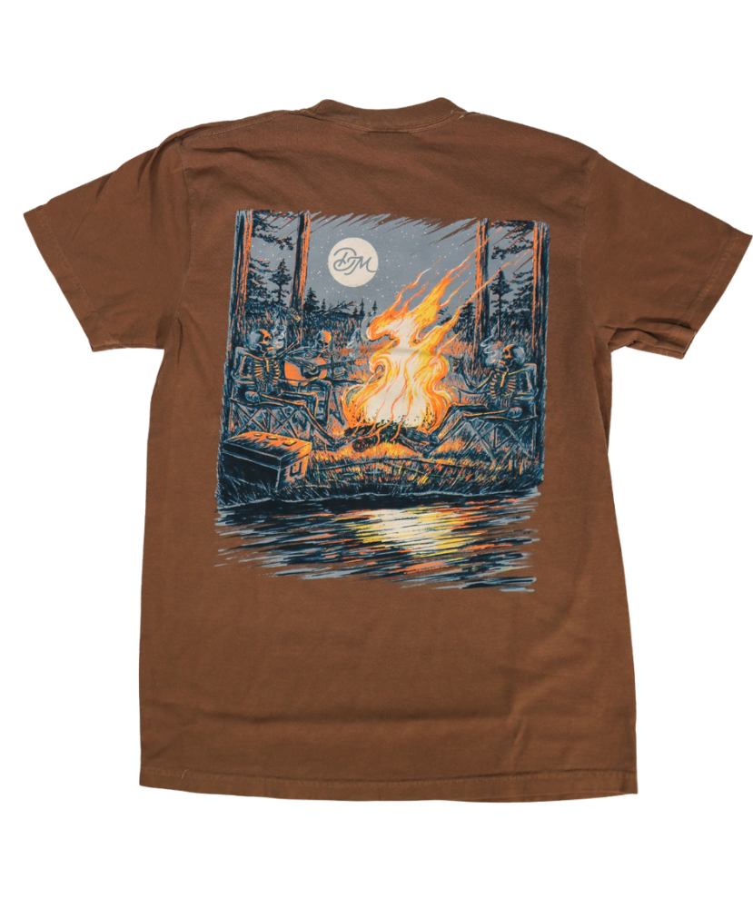 DIRTY MARSH Brown t-shirt with a graphic of a campfire and trees on a white background