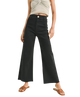 FADE BLACK pants worn by a woman on a white background