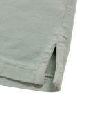 Light green Beach & Barn polo shirt with a pocket on a white background