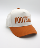 White and orange cap with 'FOOTBALL' text on a white background