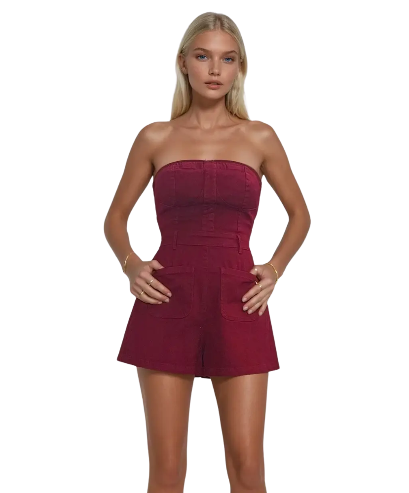 Woman wearing a strapless burgundy GARNET romper on a white background