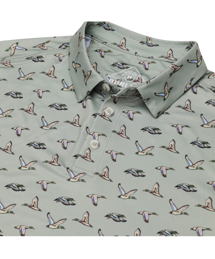 Green polo shirt with duck pattern on a white background