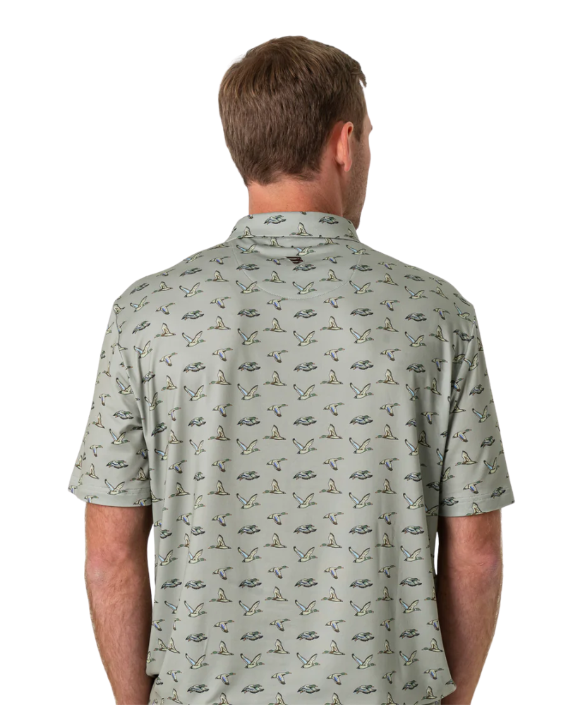 Man wearing a flying duck patterned shirt on a white background