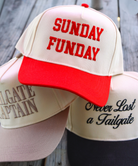 Three baseball caps with SUNDAY FUNDAY on a wooden surface