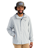 Man wearing a light gray HUK jacket and cap with a logo on a white background