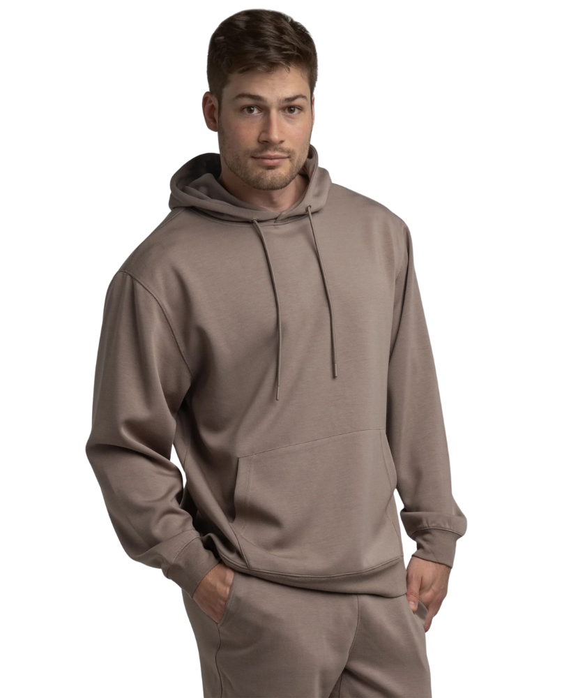 Man wearing a brown hoodie and jogger pants on a white background