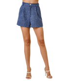 Blue shorts worn by a person on a white background