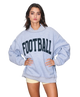 Woman wearing a heather grey sweatshirt with 'FOOTBALL' printed on it against a white background