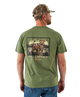 Man wearing a green t-shirt with a dog graphic and 'Field Companion' text, standing against a white background.