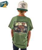 Child wearing a green t-shirt with a dog graphic and text, standing against a white background.