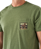 Green t-shirt with a pocket design featuring a bear and text on a white background