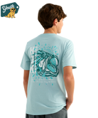 KID wearing a light blue HUK t-shirt with a bass design on the back, standing against a white background.