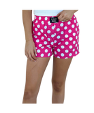 Pink polka dot shorts with a visible LULU MAC brand label on a white background