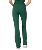 Woman wearing a green tank and pants athleisure set outfit on a white background