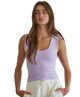 Woman wearing a purple tank top on a white background