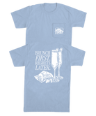 Light blue t-shirt with white graphic design of champagne and brunch and text on a white background