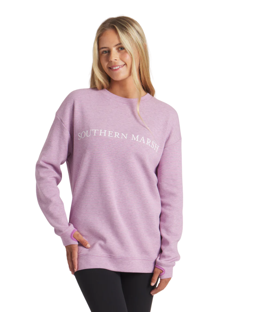 Woman wearing a purple sweatshirt with 'Southern Marsh' logo on a white background