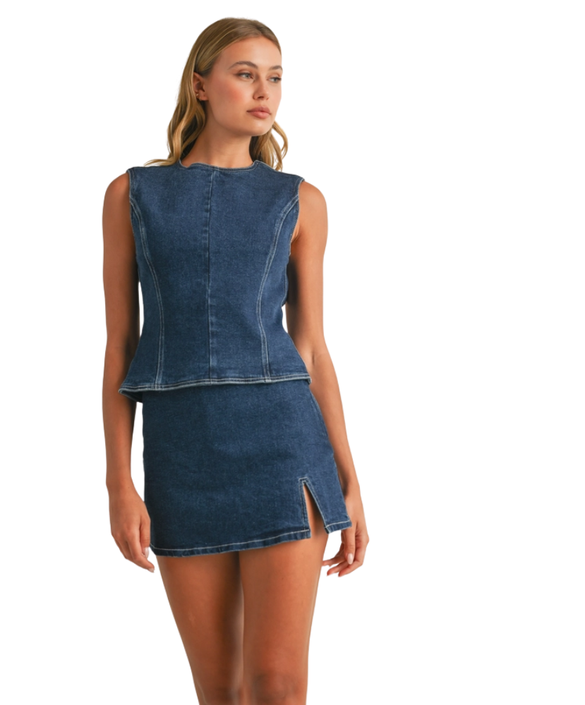 Woman wearing a denim sleeveless top and skirt on a white background