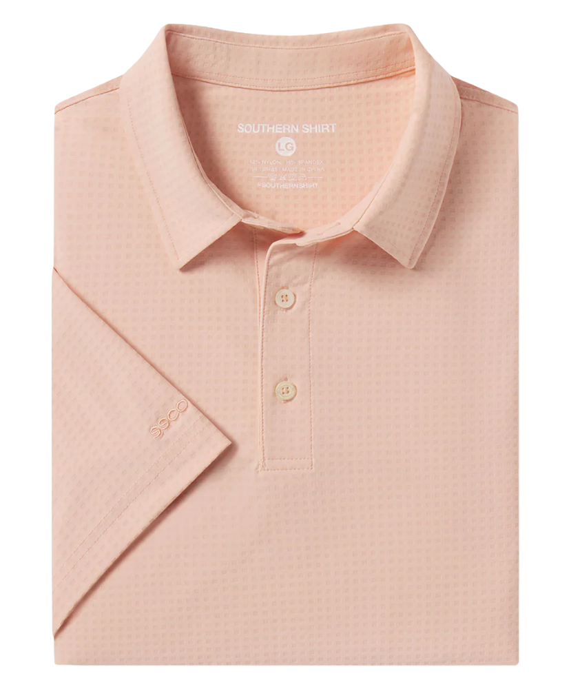 Folded pink polo shirt with 'Southern Shirt' branding on a white background