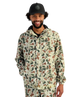 Man wearing a camouflage jacket and cap on a white background
