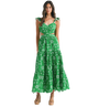 Woman wearing a green floral dress on a white background
