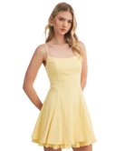 Woman wearing a yellow dress on a white background