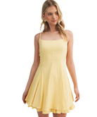 Woman wearing a yellow dress on a white background